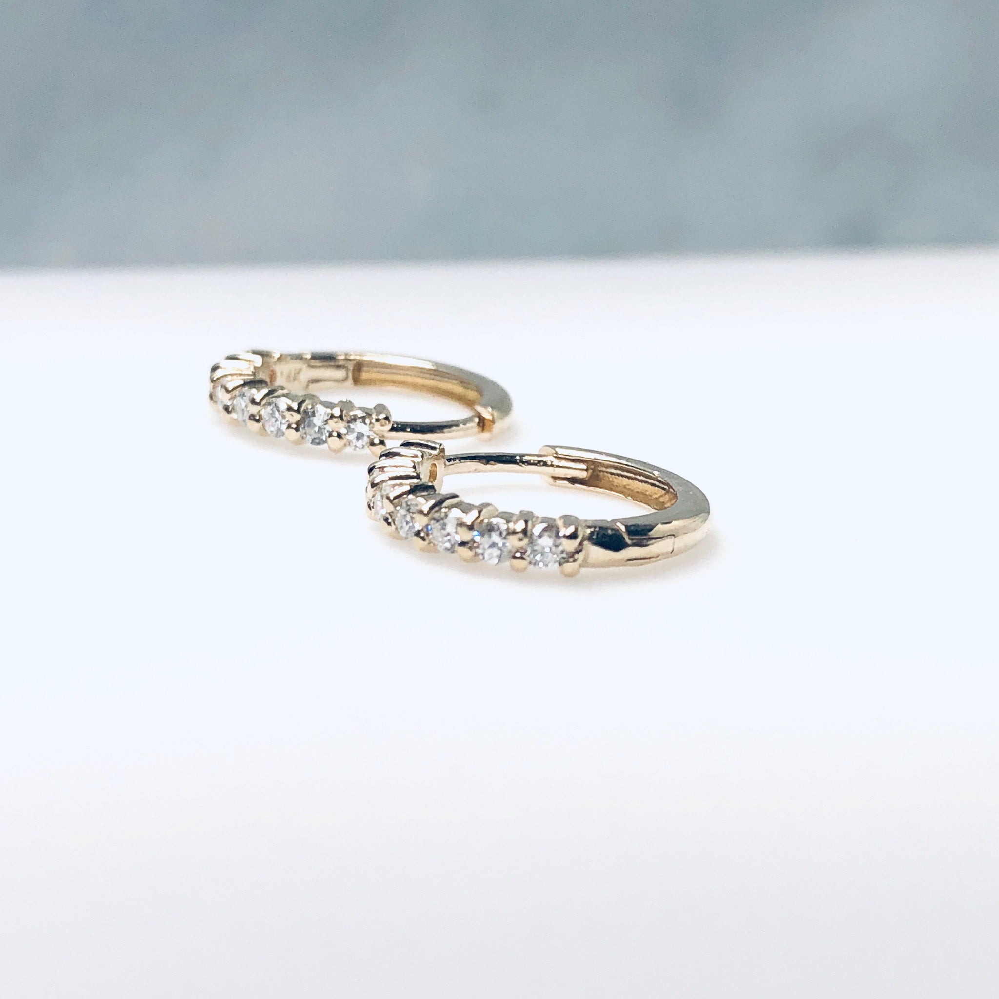 AD332 14kt gold with .35ct diamond shared prong huggie hoop