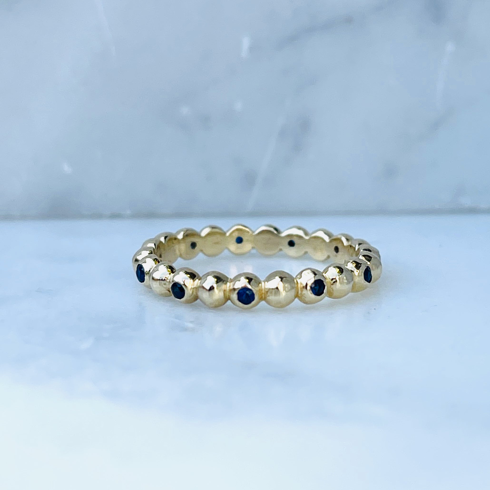 WD924 14kt gold with .22ct blue sapphire ring