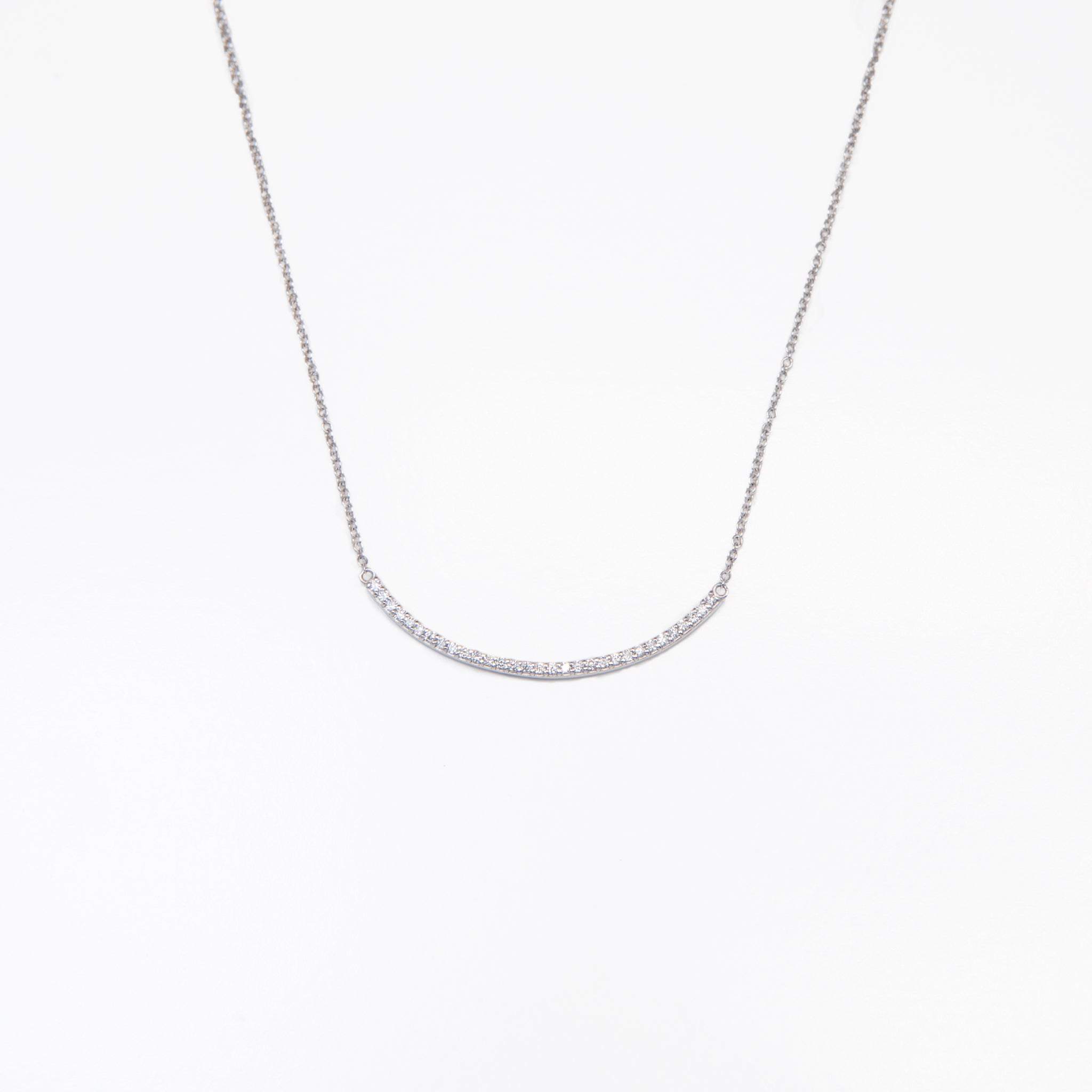 WD75white 14kt gold curved shared prong bar necklace