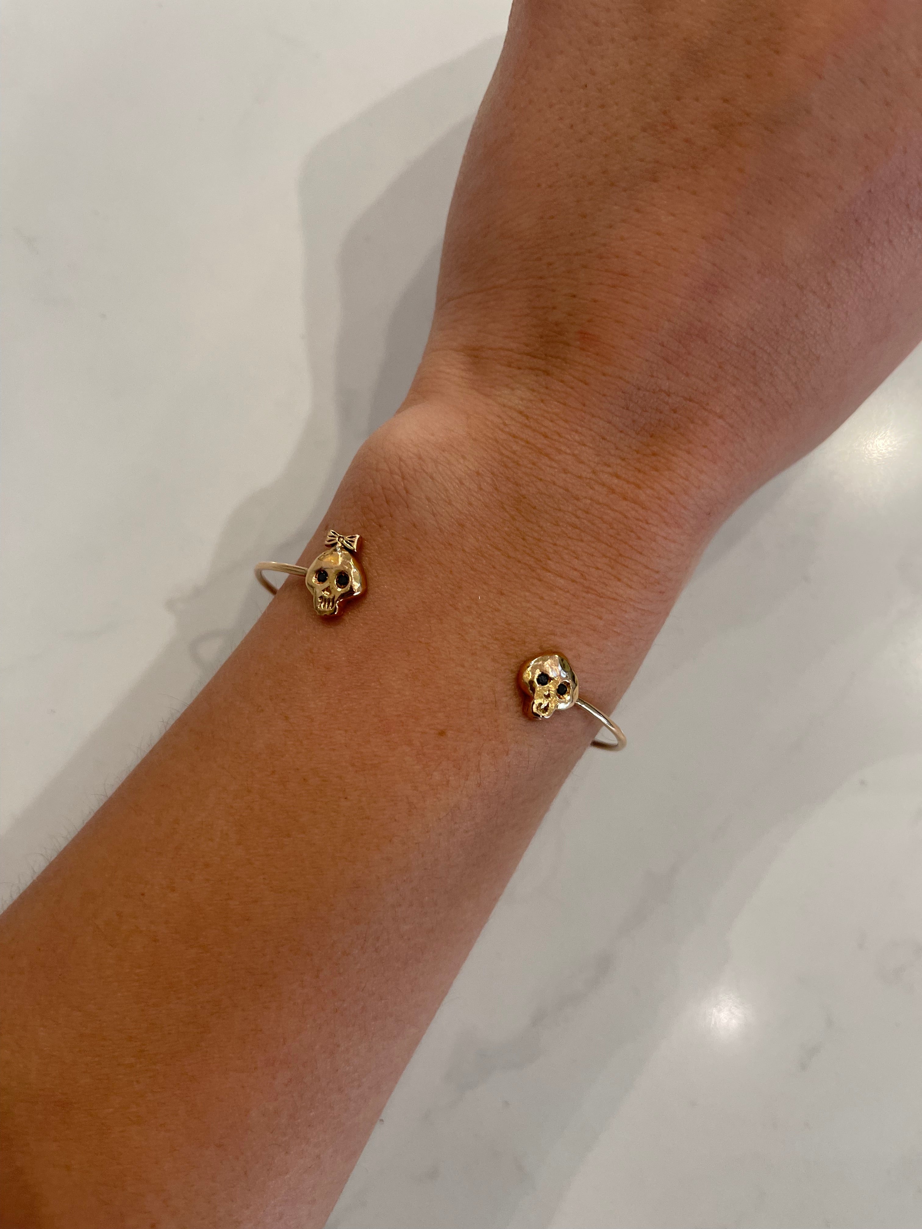 WD166 14kt gold girl and boy skull cuff