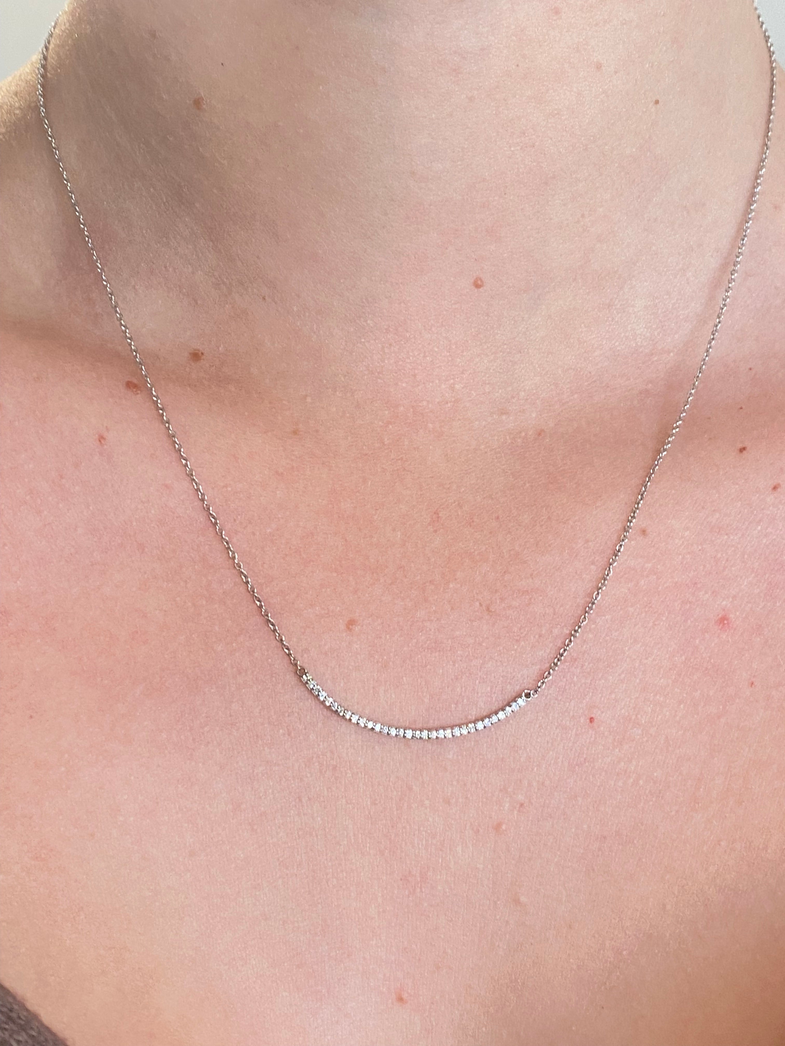 WD75white 14kt gold curved shared prong bar necklace