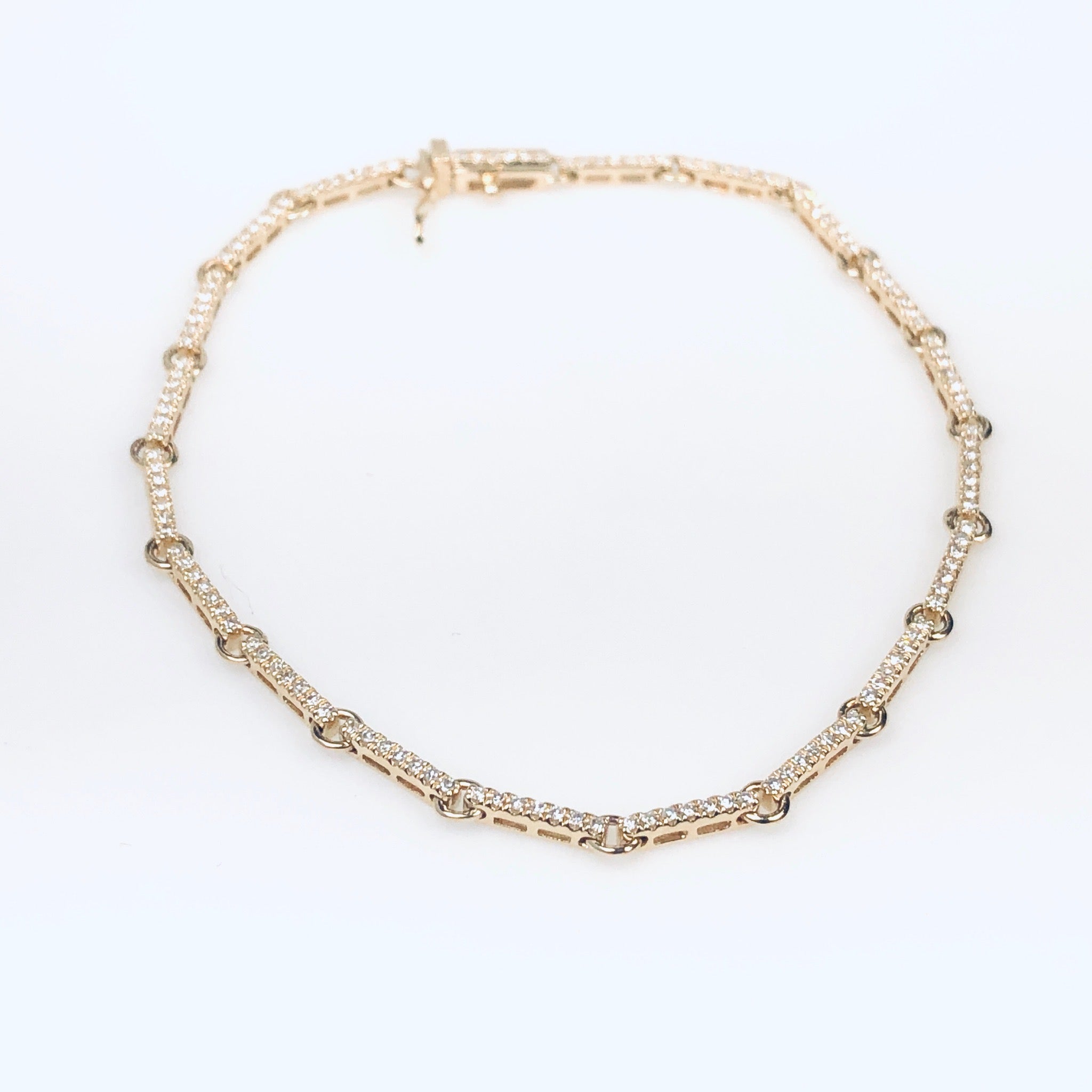 WD746 14kt gold bar link bracelet detailed with pave set diamonds