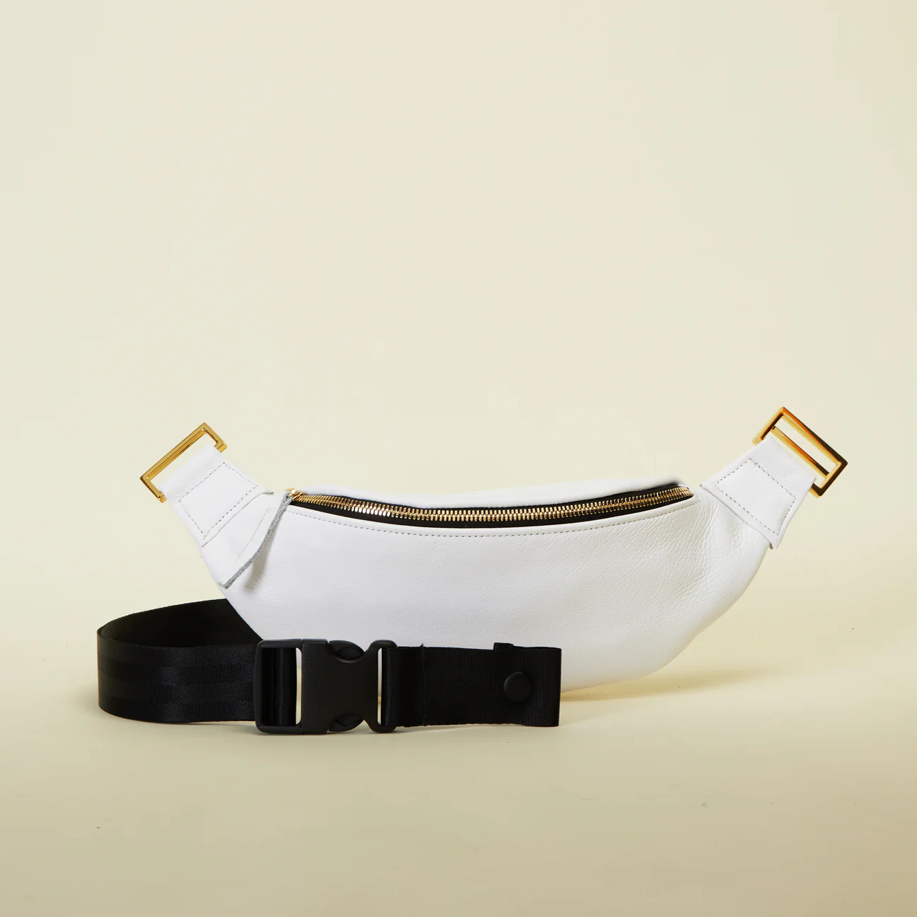 White and 2025 gold fanny pack