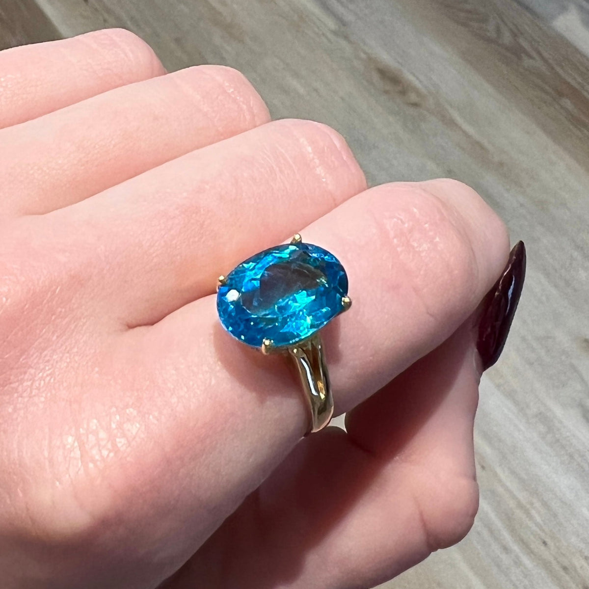14kt Yellow Gold Blue Topaz Ring worn on hand