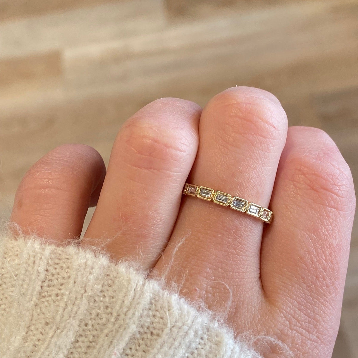 14kt Gold Emerald Cut Diamond Eternity Band worn on hand